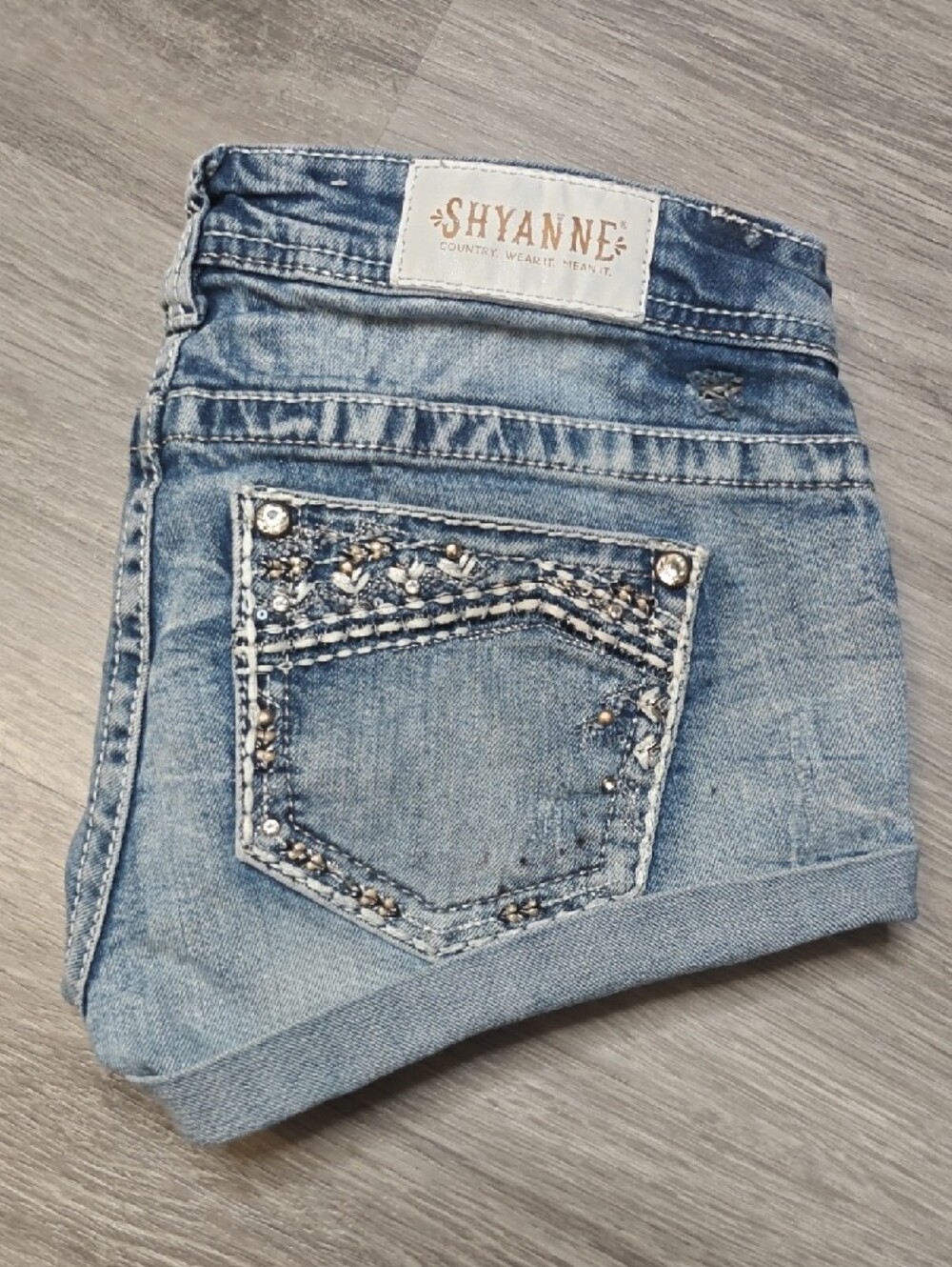 Light Wash Denim Short Shorts with Embellished Pockets